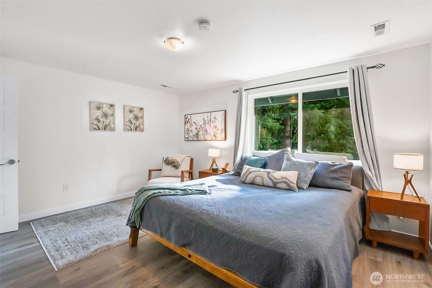 19462 324th Avenue Northeast Duvall, WA 98019 - Photo 21 of 40 a bedroom with a large bed and a large window