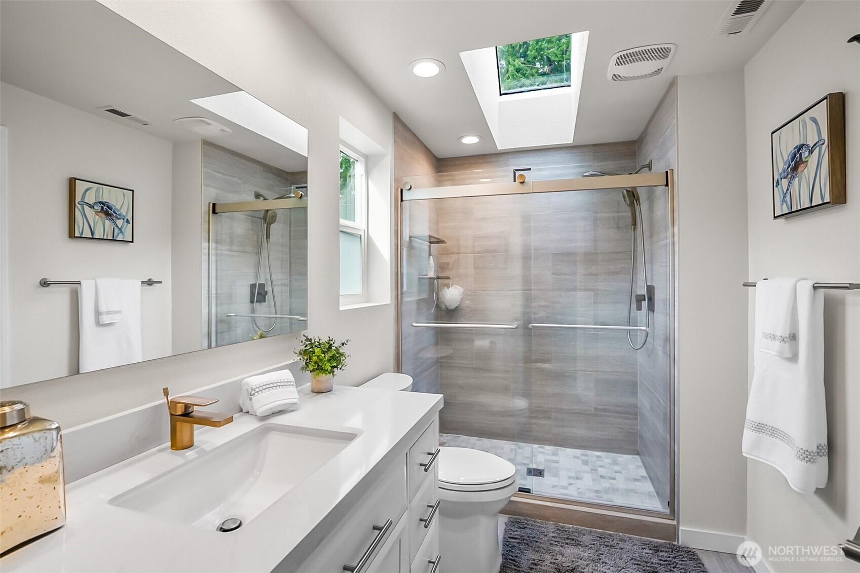 19462 324th Avenue Northeast Duvall, WA 98019 - Photo 22 of 40 a bathroom with a sink a toilet and shower