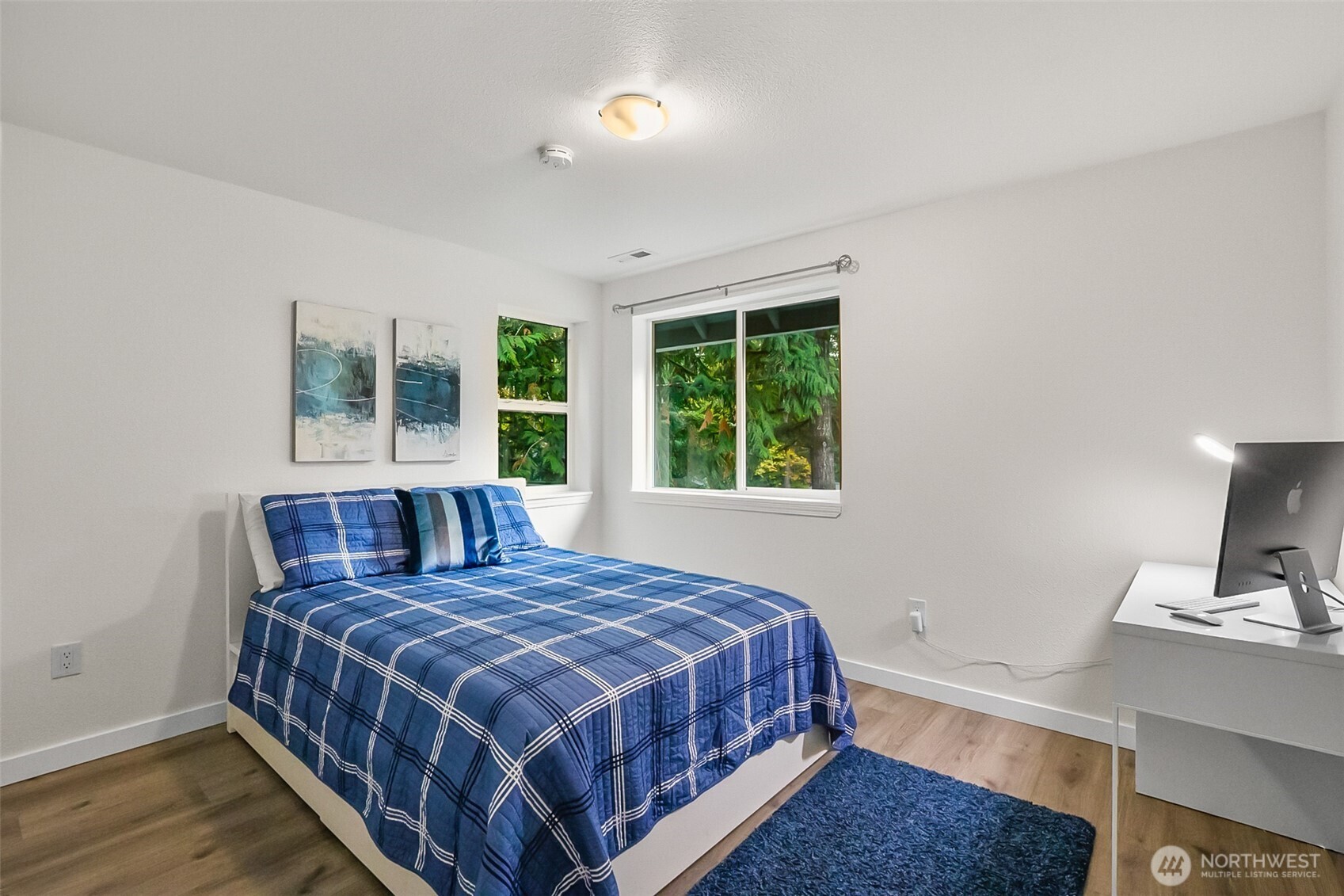 19462 324th Avenue Northeast Duvall, WA 98019 - Photo 23 of 40 a bedroom with a bed a mirror and a window