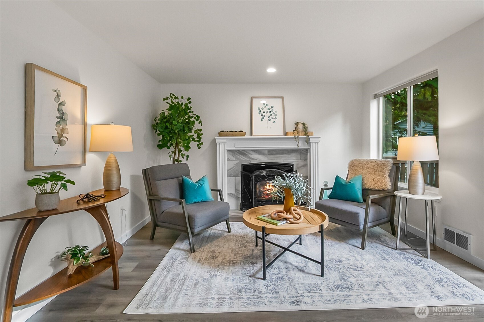 19462 324th Avenue Northeast Duvall, WA 98019 - Photo 8 of 40 a living room with furniture and a fireplace