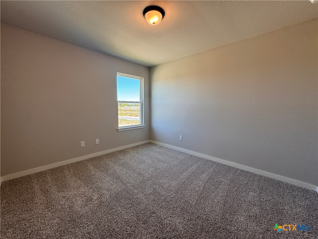 409 University Avenue Troy, TX 76579 - Photo 13 of 20 an empty room with windows