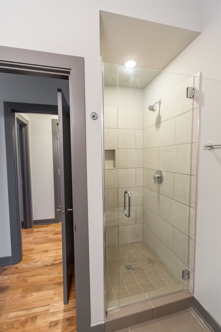 Undisclosed Address Chicago, IL 60657 - Photo 12 of 13 a bathroom with a shower