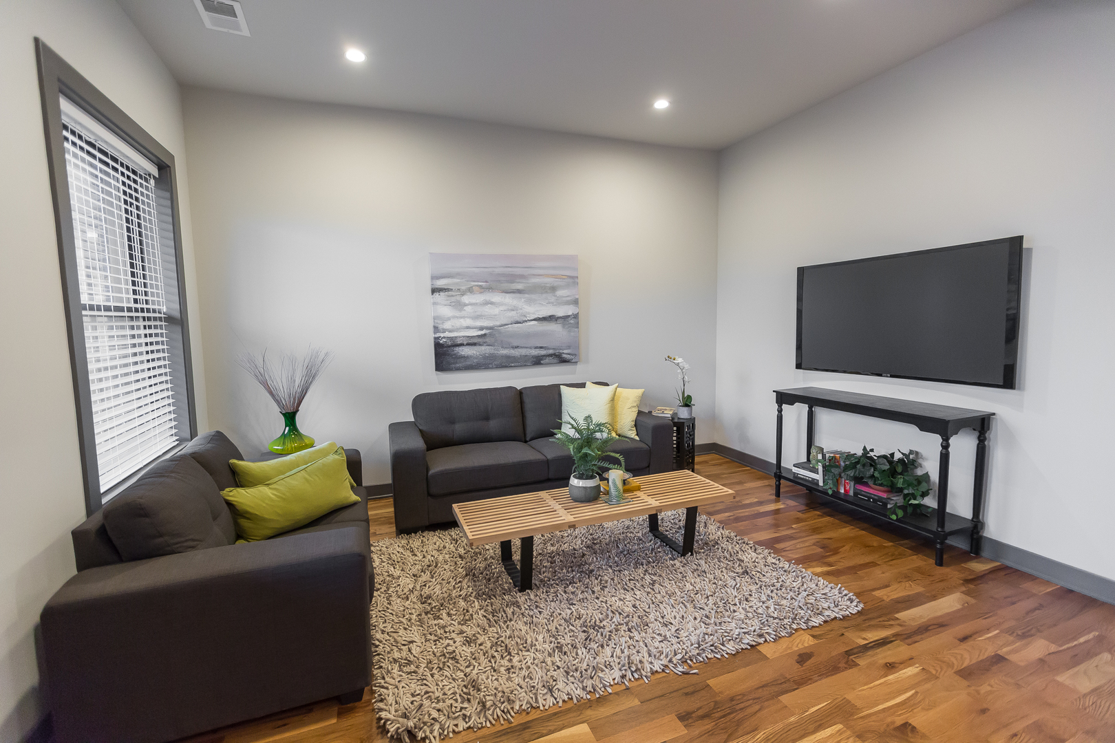 Undisclosed Address Chicago, IL 60657 - Photo 6 of 13 a living room with furniture and a flat screen tv