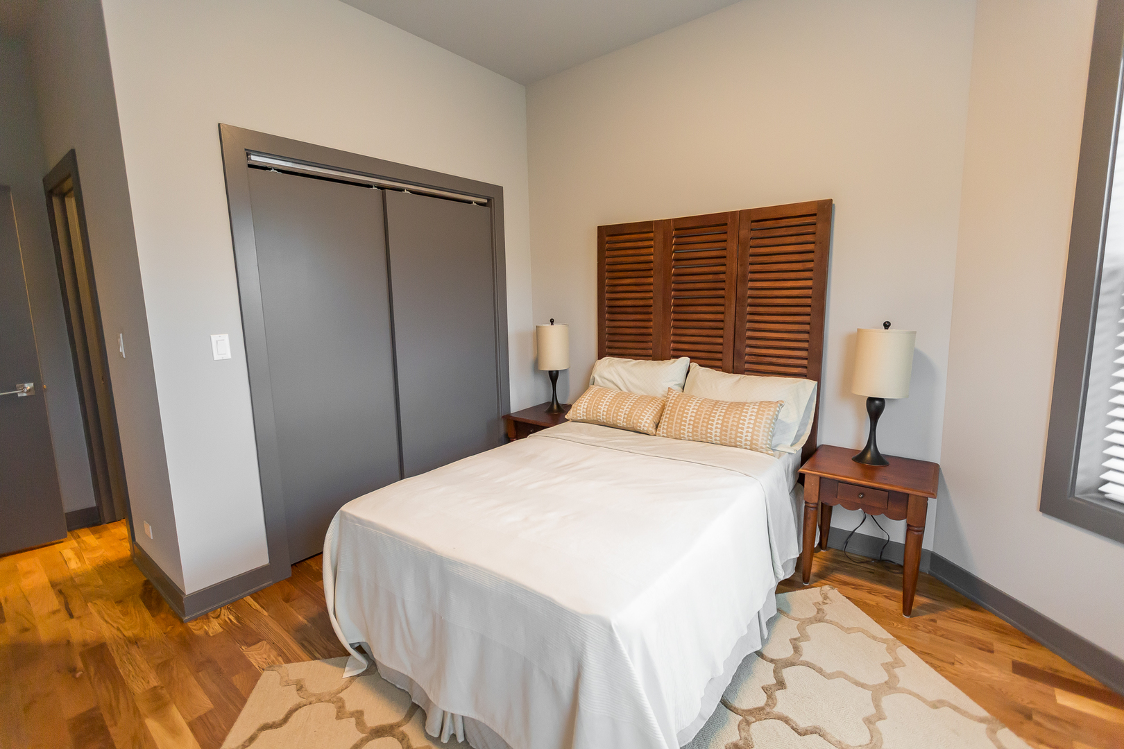 Undisclosed Address Chicago, IL 60657 - Photo 8 of 13 a bedroom with a bed and a window