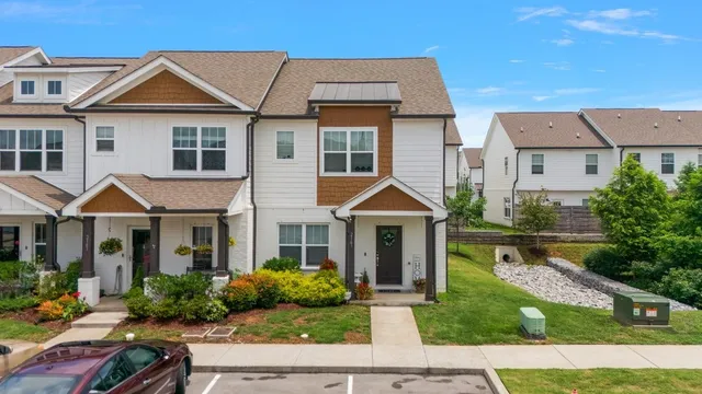 a front view of a house with a yard