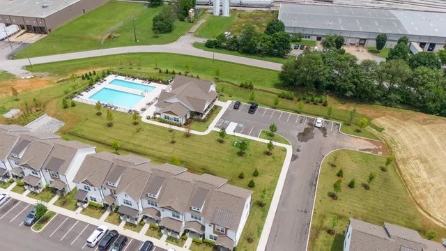 an aerial view of a house with a garden and a yard