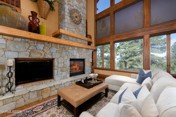 a kitchen with granite countertop a stove a sink and dishwasher wooden cabinets with wooden floor