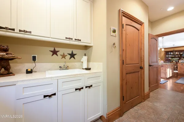 a spacious bathroom with a double vanity sink double and a mirror