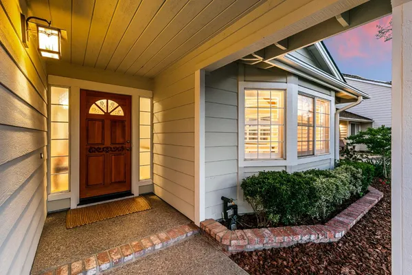 a view of a house with a small yard