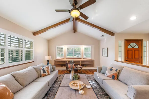 a living room with furniture and a large window