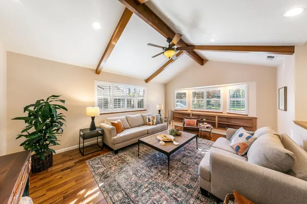 a living room with furniture and a large window