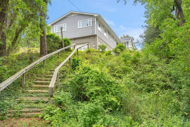 a view of a house with a small yard