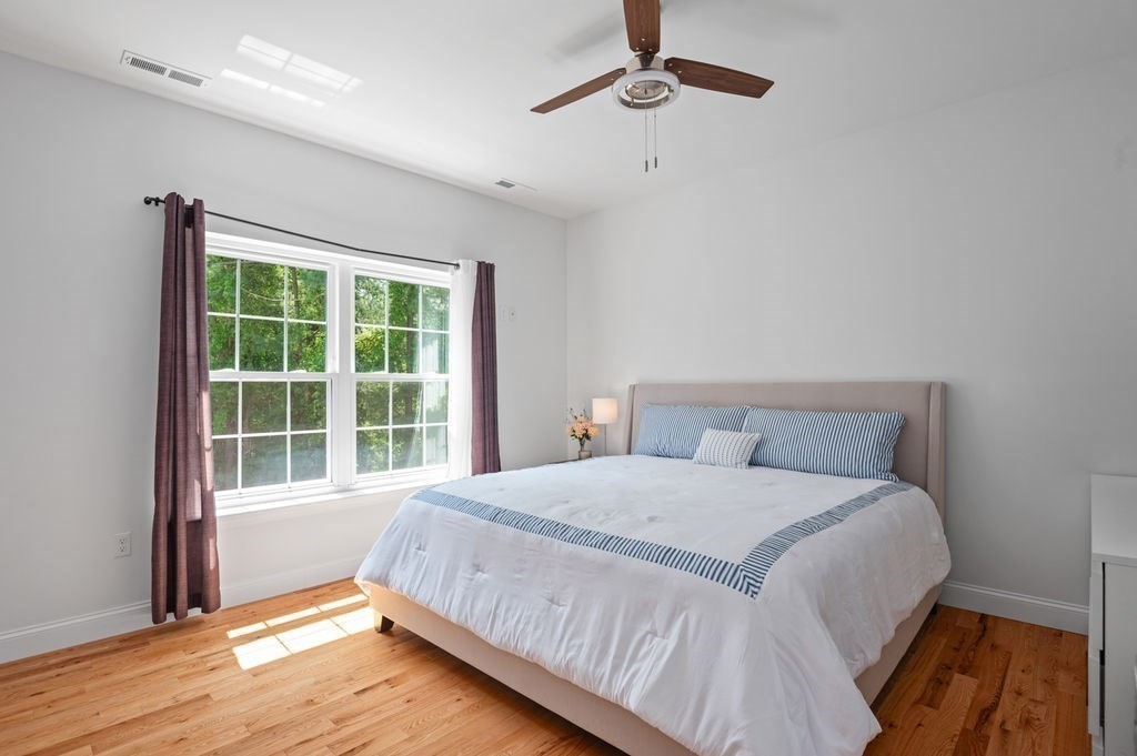 196 Main Street, Unit 196 Groveland, MA 01834 - Photo 12 of 35 a bedroom with a bed and a window