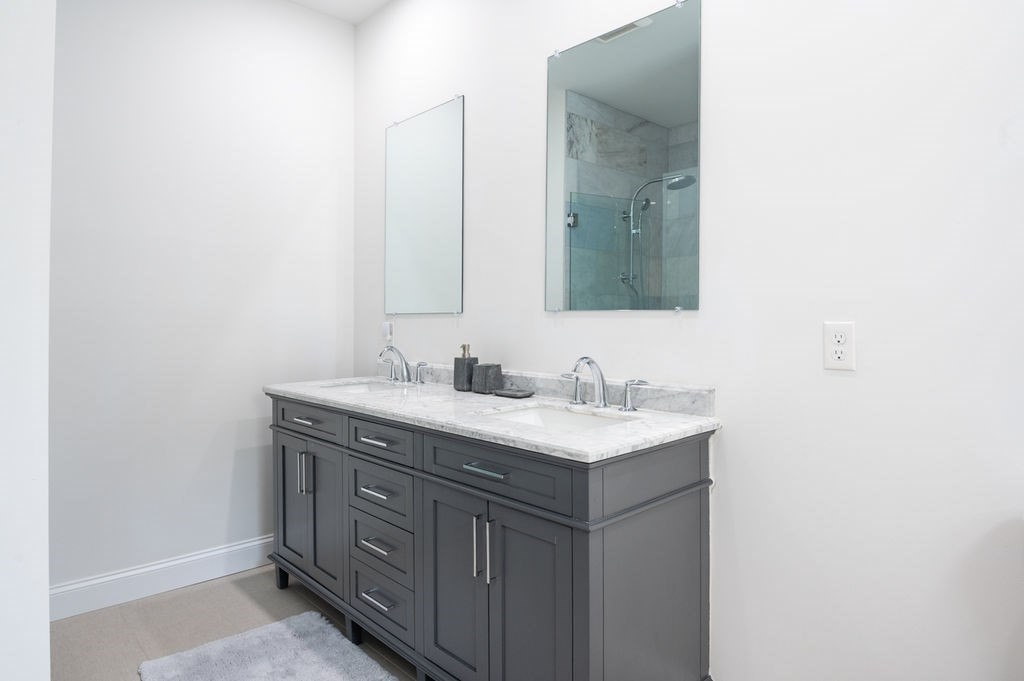196 Main Street, Unit 196 Groveland, MA 01834 - Photo 15 of 35 a bathroom with a sink and a mirror