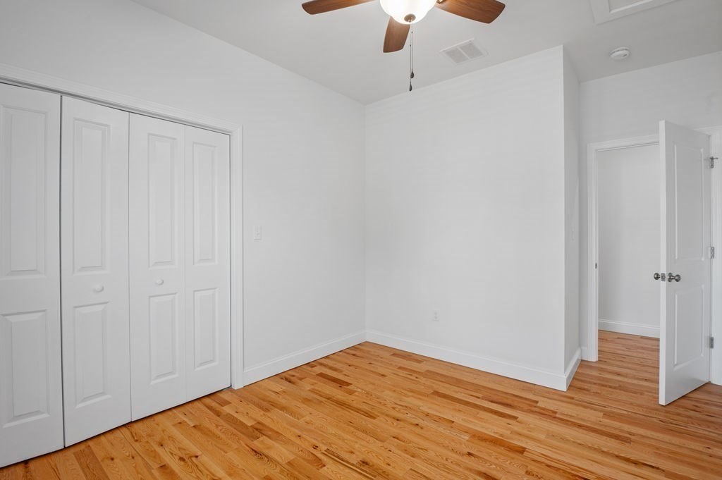 196 Main Street, Unit 196 Groveland, MA 01834 - Photo 20 of 35 a view of empty room with wooden floor
