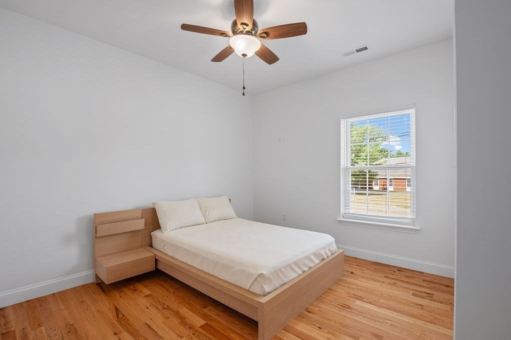 196 Main Street, Unit 196 Groveland, MA 01834 - Photo 21 of 35 a bedroom with a bed and a window