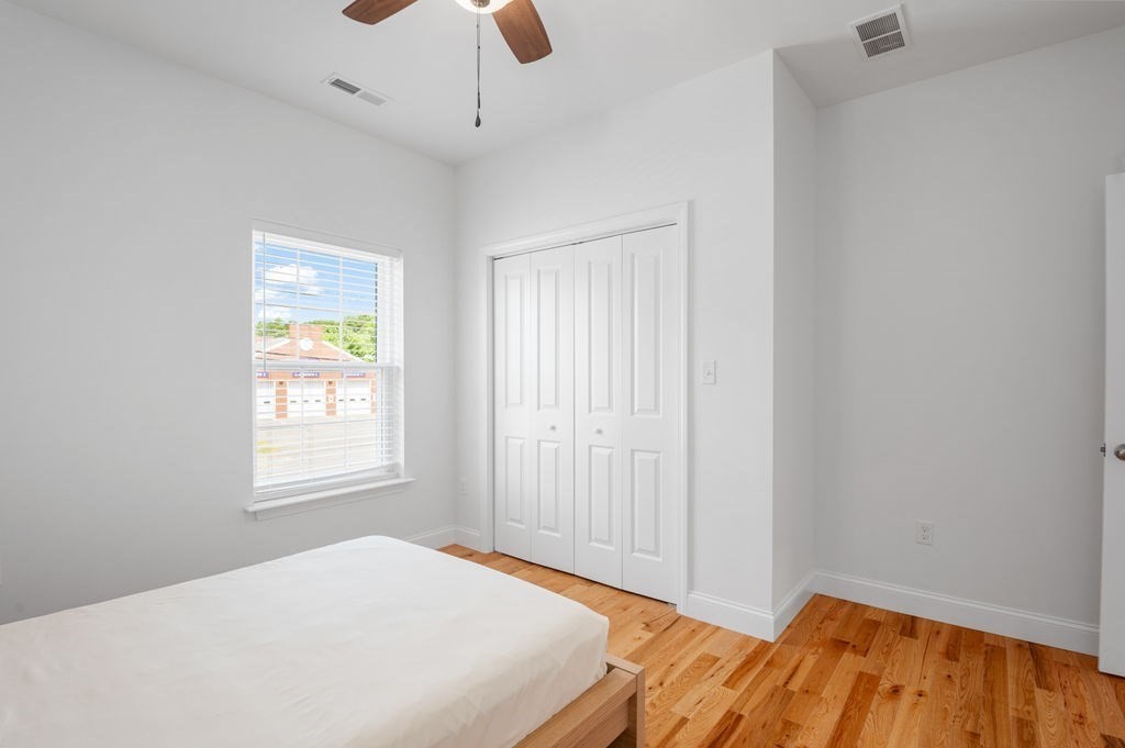 196 Main Street, Unit 196 Groveland, MA 01834 - Photo 22 of 35 a bedroom with a bed and a window