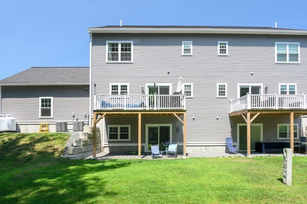 196 Main Street, Unit 196 Groveland, MA 01834 - Photo 29 of 35 a front view of a house with a yard