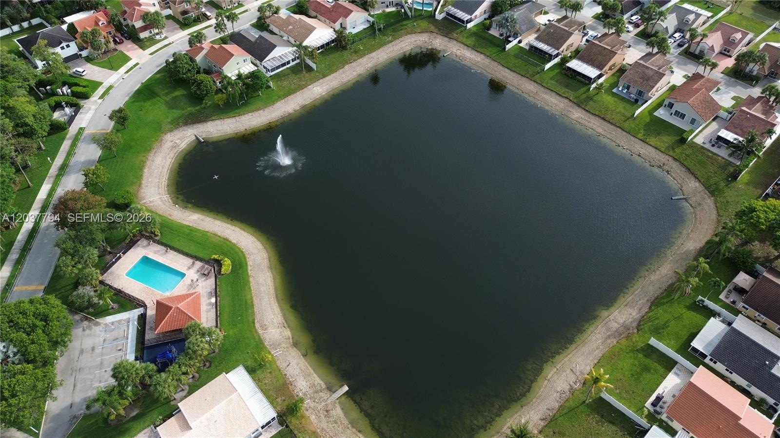 10180 Fanfare Drive, Unit 10180 Boca Raton, FL 33428 - Photo 32 of 33 Adjacent Lake to Commnity Pool