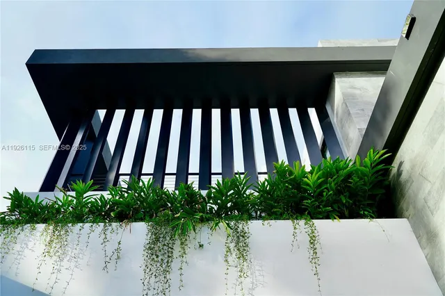 a view of a house with backyard porch and sitting area