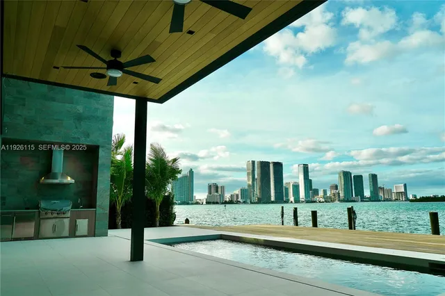 a view of a patio with table and chairs potted plants with wooden floor