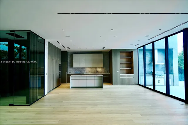 a view of kitchen with refrigerator and window