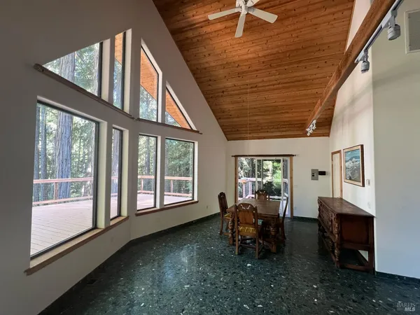 a dining room with furniture and window