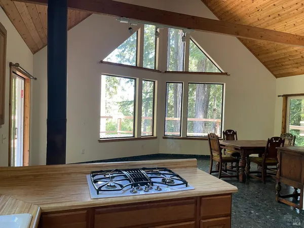 a kitchen with stainless steel appliances granite countertop a stove and a refrigerator