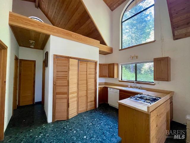 35905 Hauser Bridge Road, Unit J Cazadero, CA 95421 - Photo 15 of 34 a kitchen with stainless steel appliances granite countertop a stove and a refrigerator