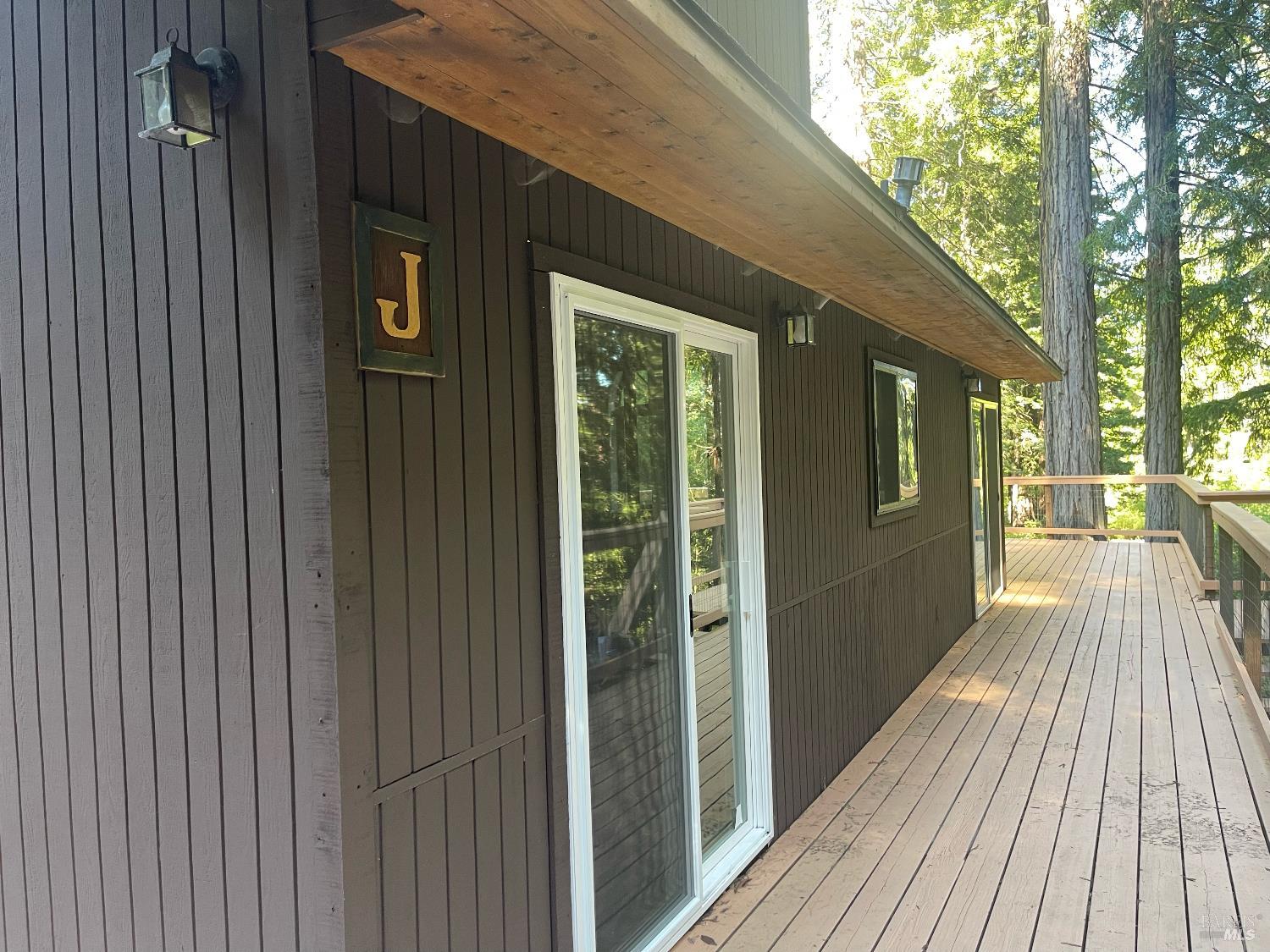 35905 Hauser Bridge Road, Unit J Cazadero, CA 95421 - Photo 6 of 34 a view of a house with a porch