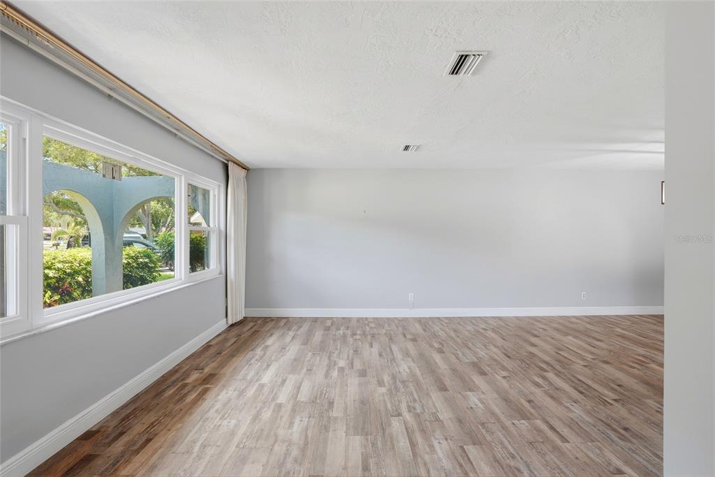 9760 136th Street Seminole, FL 33776 - Photo 11 of 41 a view of wooden floor in a room