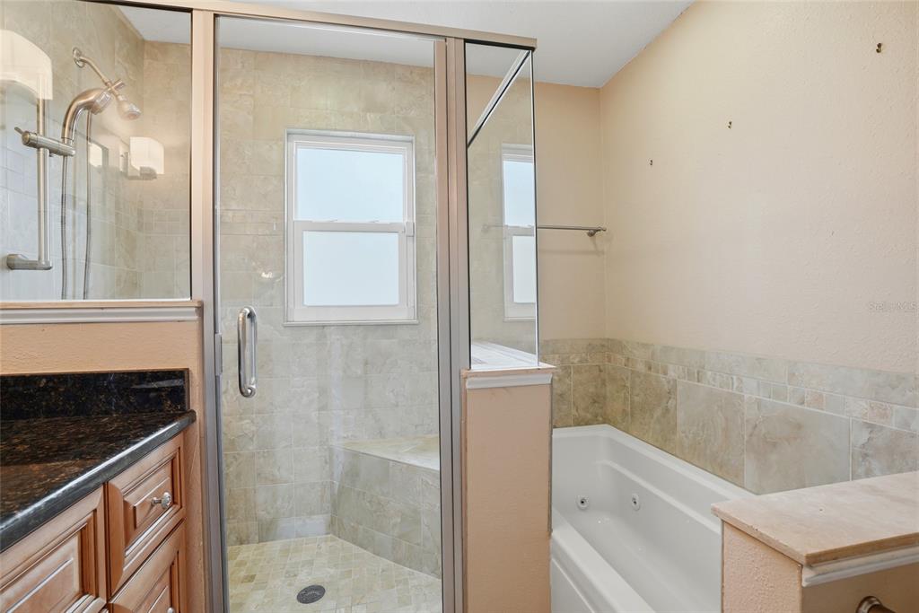 9760 136th Street Seminole, FL 33776 - Photo 20 of 41 a bathroom with a shower and a sink