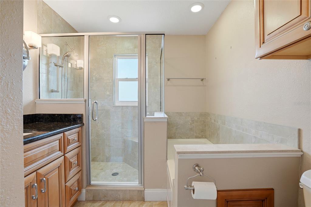 9760 136th Street Seminole, FL 33776 - Photo 22 of 41 a bathroom with a shower and a sink