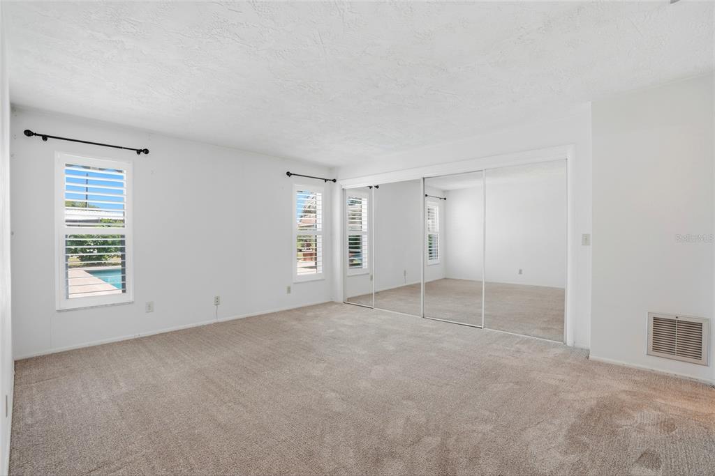 9760 136th Street Seminole, FL 33776 - Photo 23 of 41 an empty room with windows