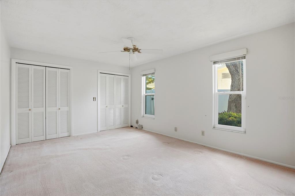 9760 136th Street Seminole, FL 33776 - Photo 25 of 41 a view of an empty room with a window