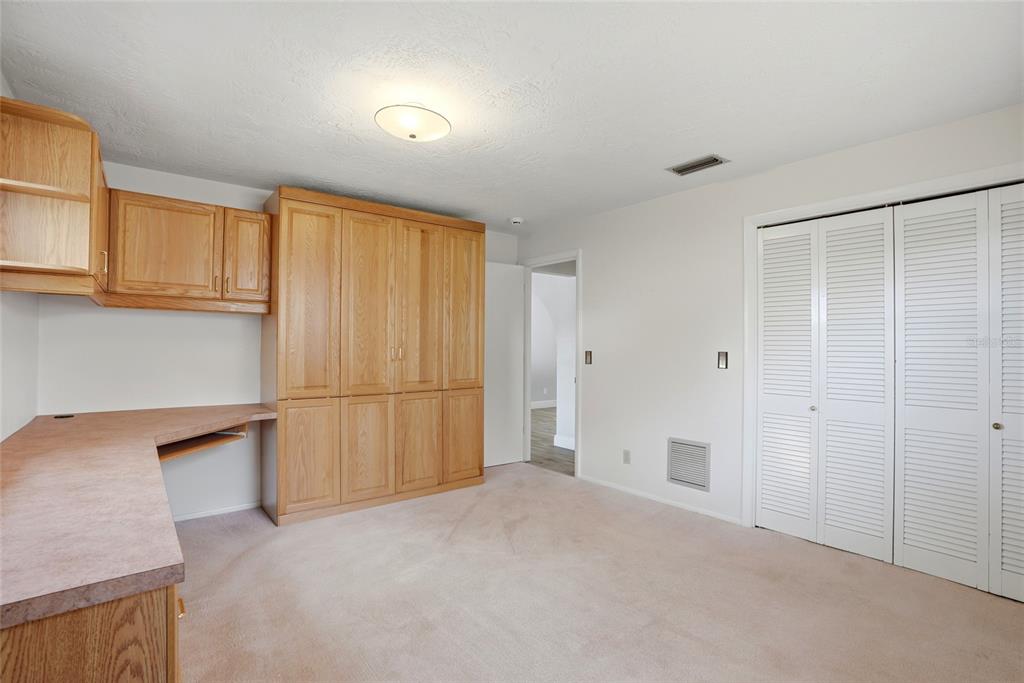 9760 136th Street Seminole, FL 33776 - Photo 27 of 41 a view of a kitchen with a sink and cabinets