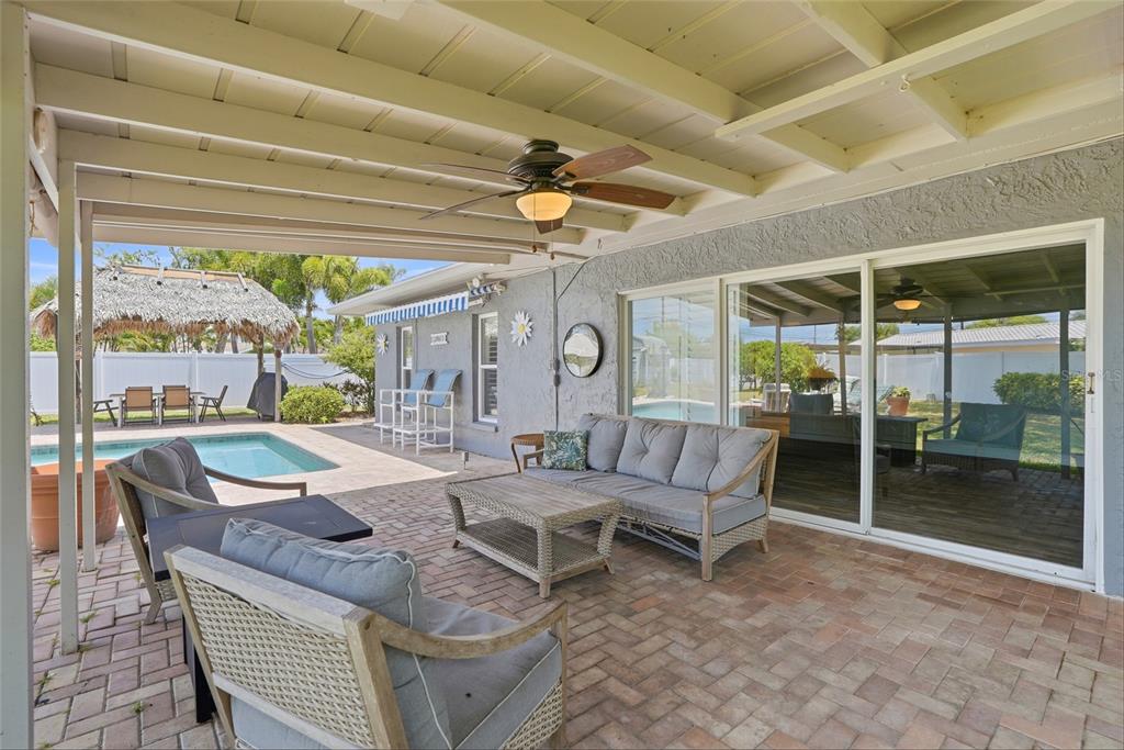 9760 136th Street Seminole, FL 33776 - Photo 31 of 41 a outdoor space with patio the couches and a dining table with the view of the balcony