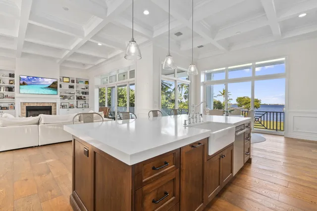 a large kitchen with a table and chairs