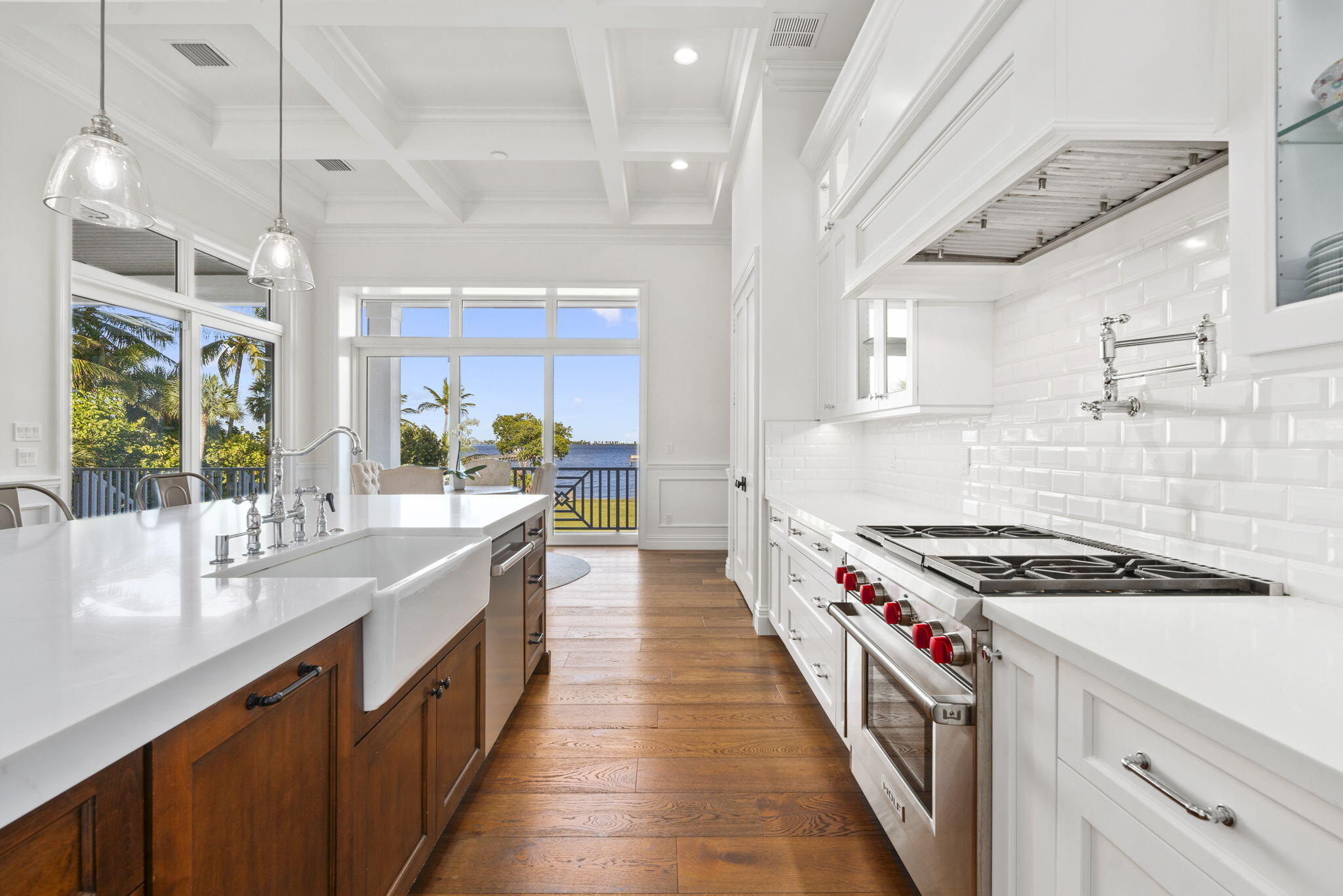 54 South Sewalls Point Road Sewall's Point, FL 34996 - Photo 15 of 68 a kitchen with stainless steel appliances a sink stove and cabinets