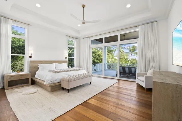 a spacious bathroom with a double vanity sink a mirror and a bathtub