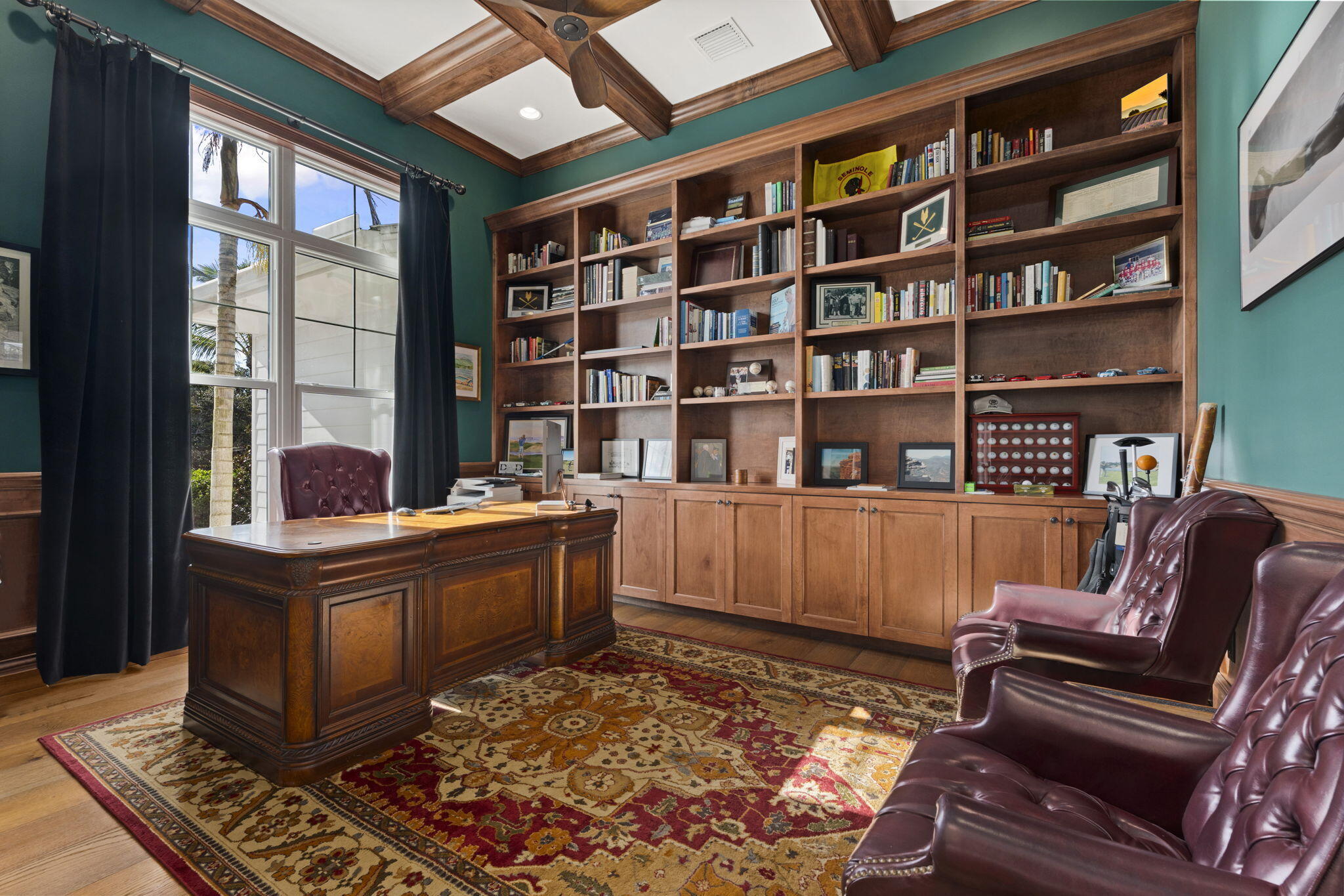54 South Sewalls Point Road Sewall's Point, FL 34996 - Photo 26 of 68 a living room with fireplace furniture and a book shelf