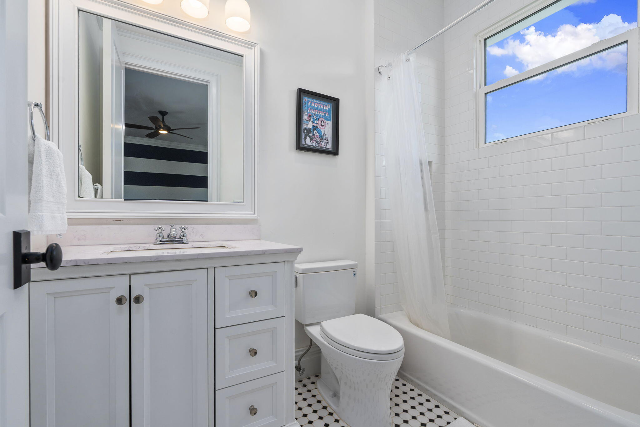 54 South Sewalls Point Road Sewall's Point, FL 34996 - Photo 29 of 68 a bathroom with a toilet a sink a mirror and vanity