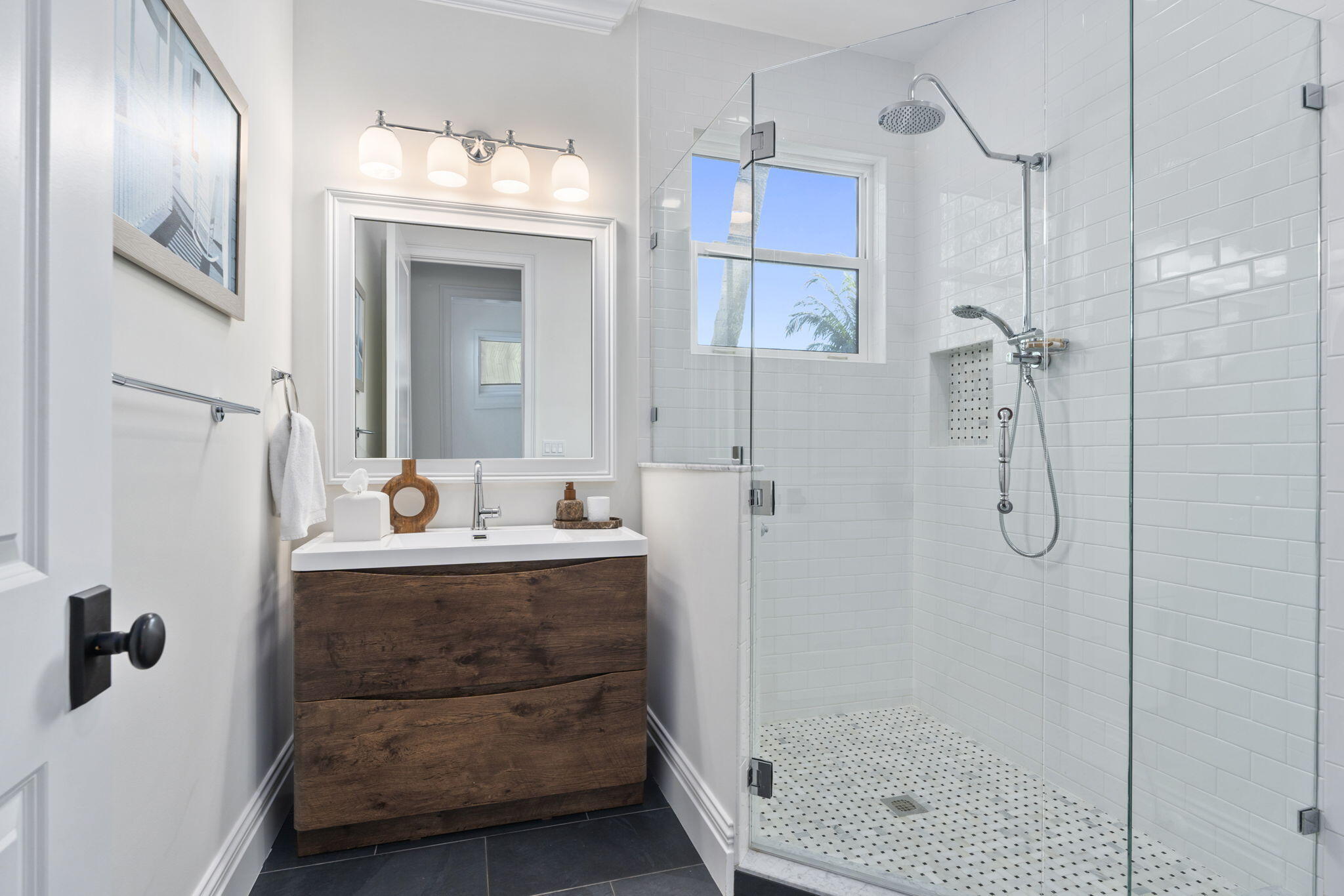 54 South Sewalls Point Road Sewall's Point, FL 34996 - Photo 31 of 68 a bathroom with a granite countertop sink mirror and shower