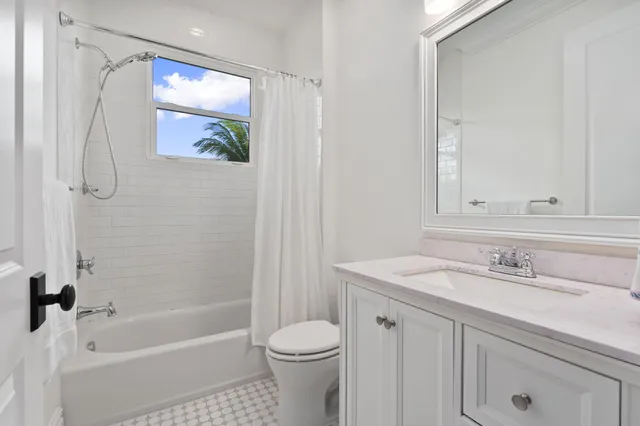a view of a chairs and table on the balcony