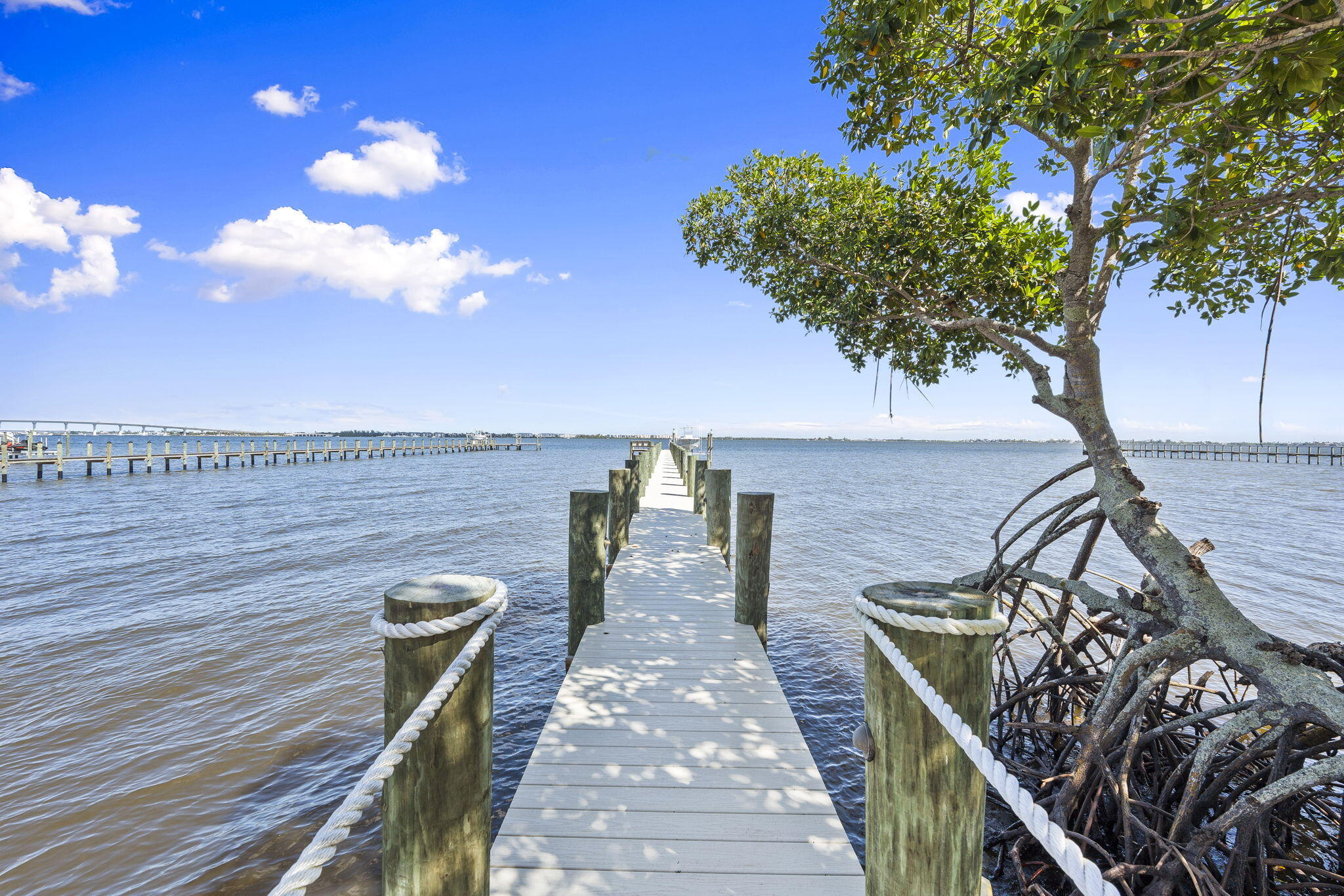 54 South Sewalls Point Road Sewall's Point, FL 34996 - Photo 45 of 68 a view of a balcony with chairs