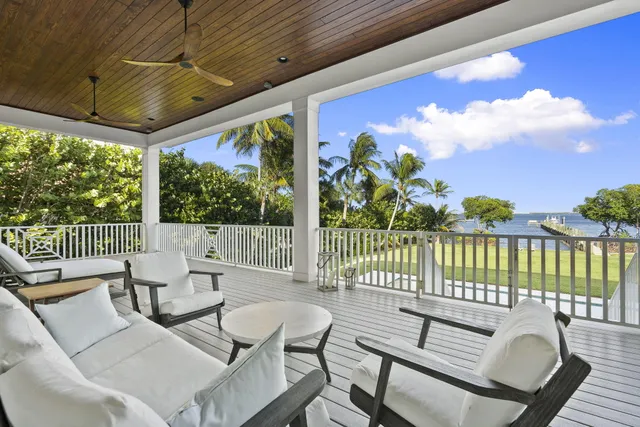 a view of a backyard with swimming pool
