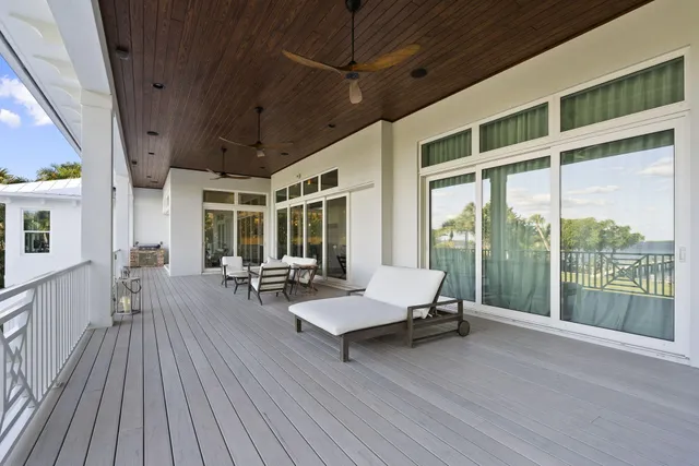 a view of a terrace with a table and chairs