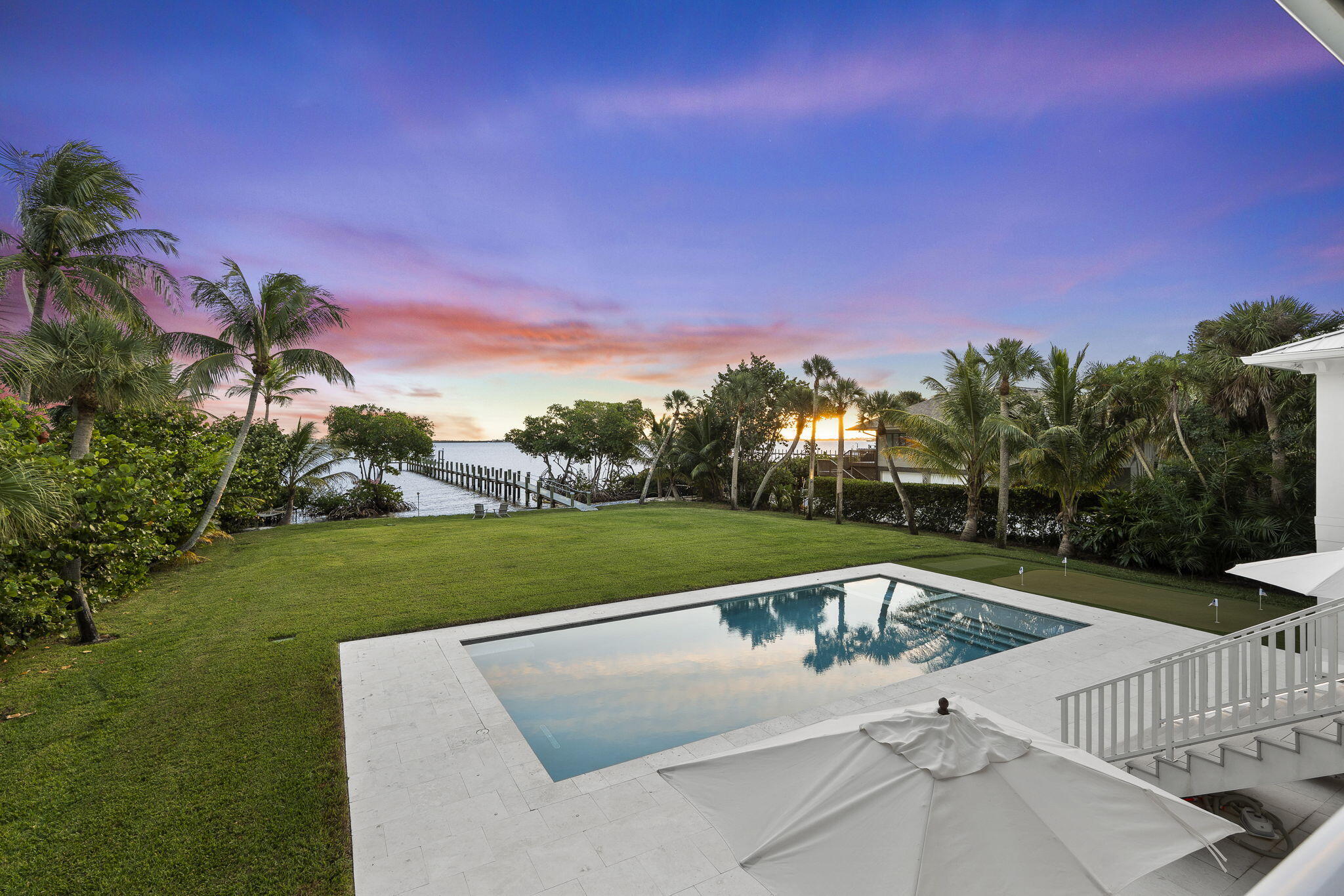54 South Sewalls Point Road Sewall's Point, FL 34996 - Photo 64 of 68 a view of a backyard with swimming pool