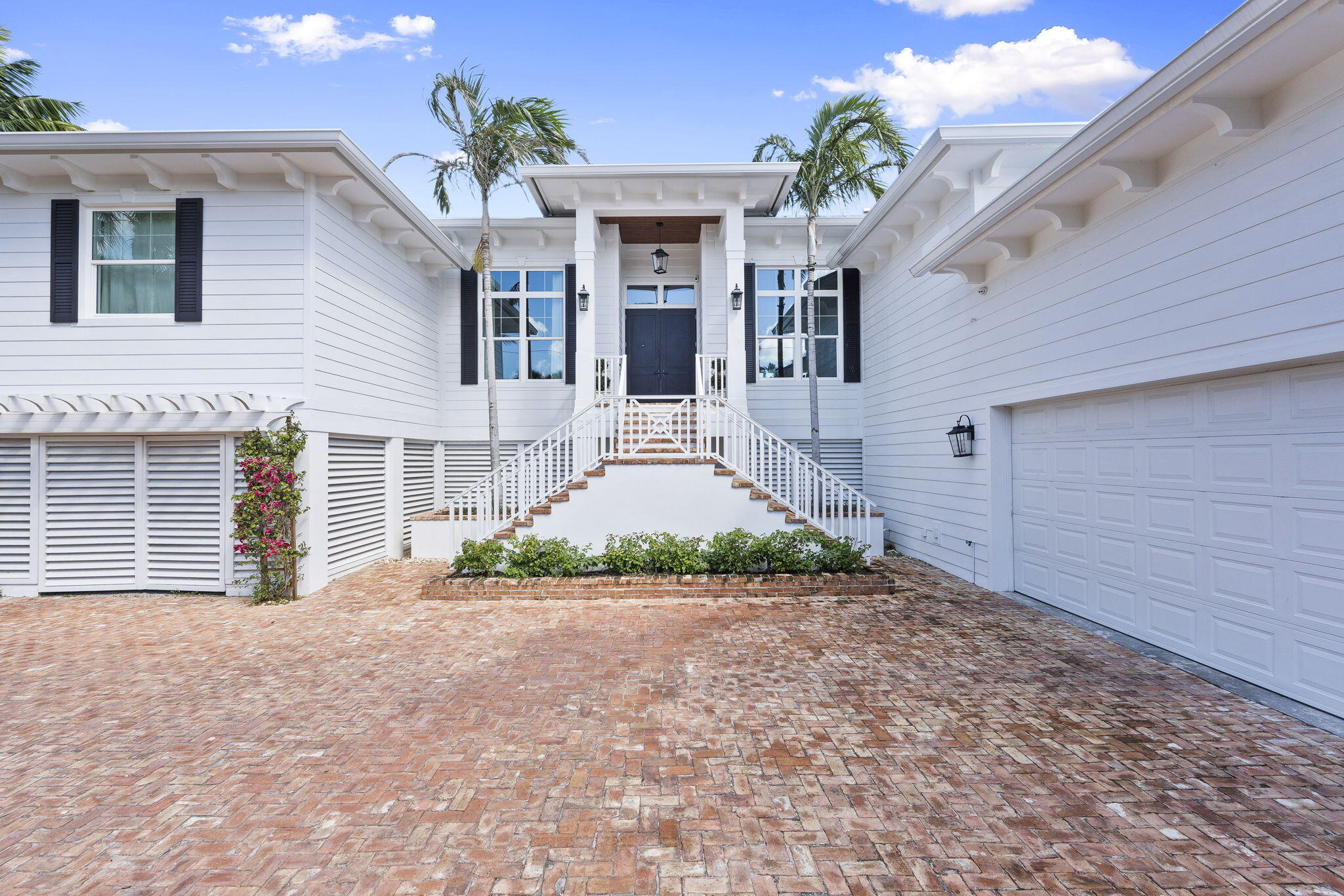 54 South Sewalls Point Road Sewall's Point, FL 34996 - Photo 7 of 68 a front view of a house with garden
