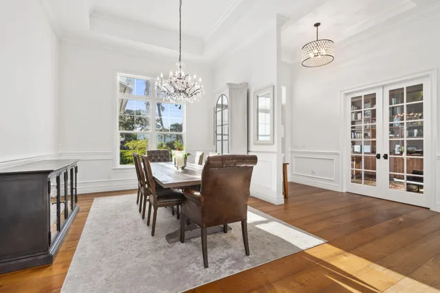 a living room with furniture large window and fireplace